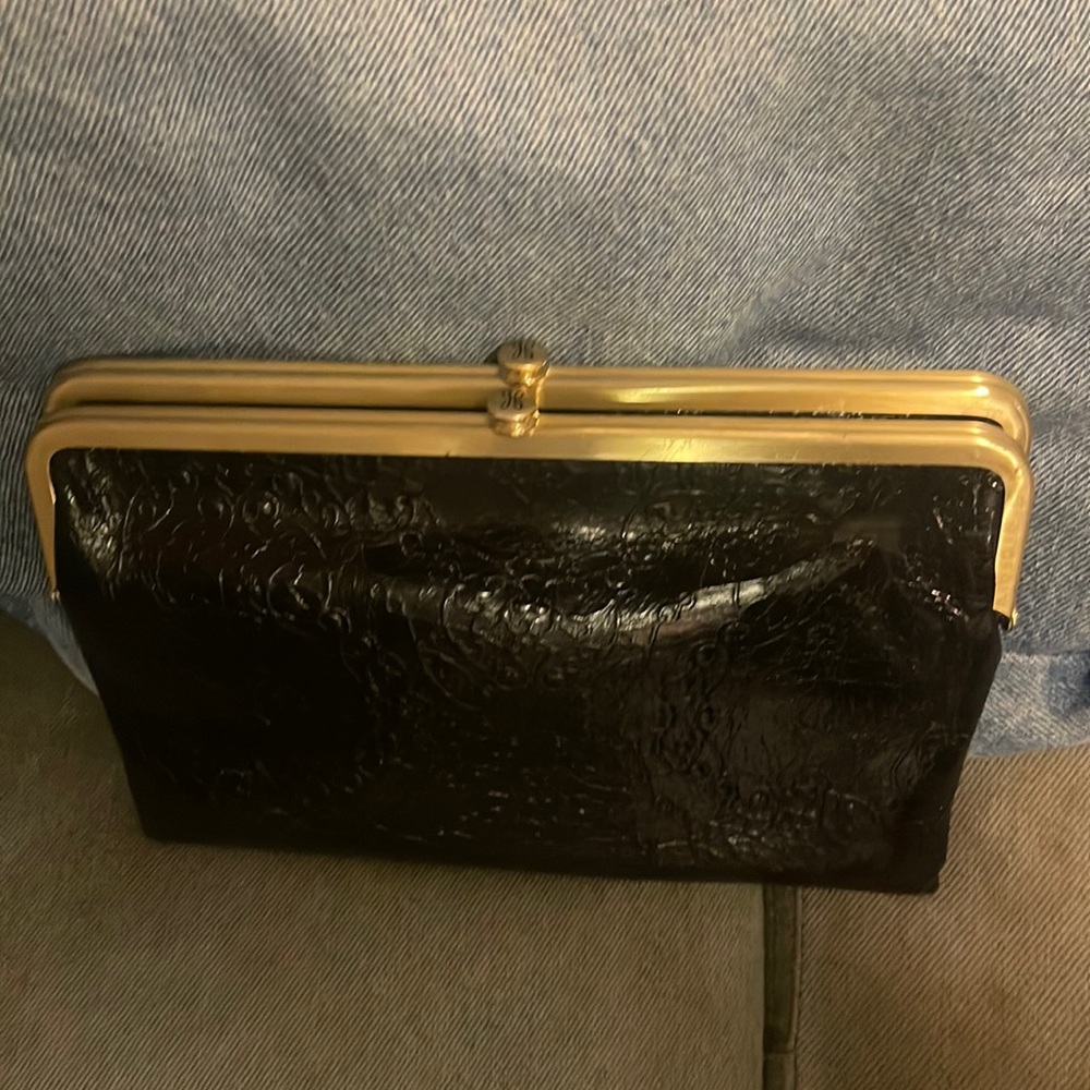 HOBO black double clutch wallet brushed gold accent magnetic strap hardware